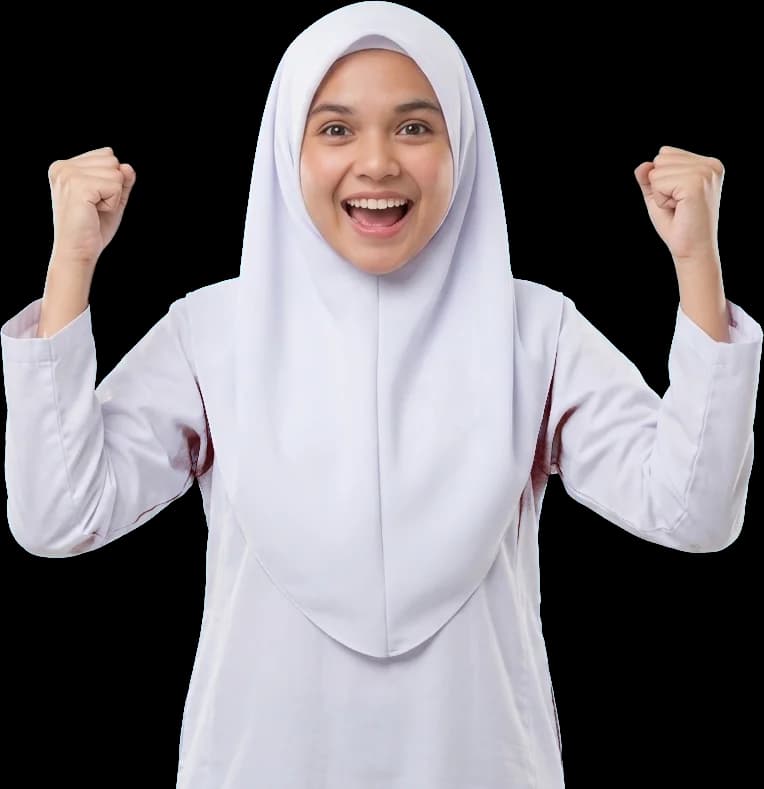 A secondary school student in a white baju kurung and tudung celebrating with both fists raised